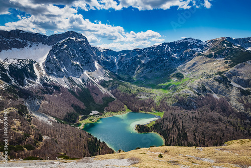 landscape with mountains, lake and blue sky