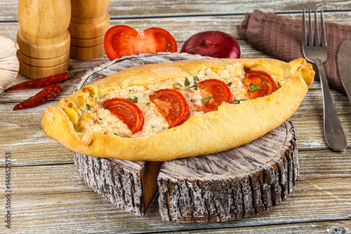 Obraz na płótnie Turkish Pide with cheese and tomato w salonie