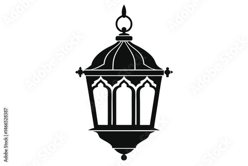 The black silhouette of a hanging, ornate, Islamic lantern showcases its simple yet detailed form