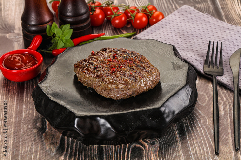Grilled beef burger cutlet with sauce