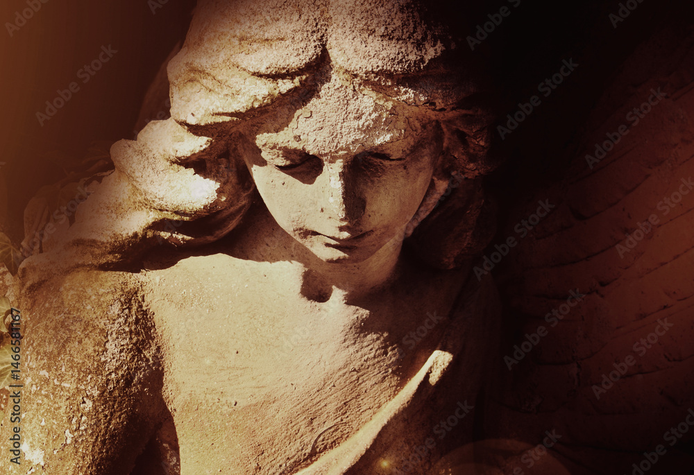 Fragment of beautiful angel in the sunlight. Horizontal image.