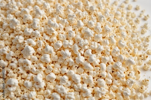 A mound of fluffy popcorn kernels against a pure white backdrop , detail, leisure, photography