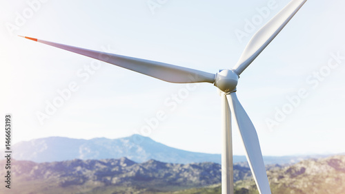 Obraz na płótnie Wind turbine rotating and generating clean energy with a mountain landscape in the background w salonie
