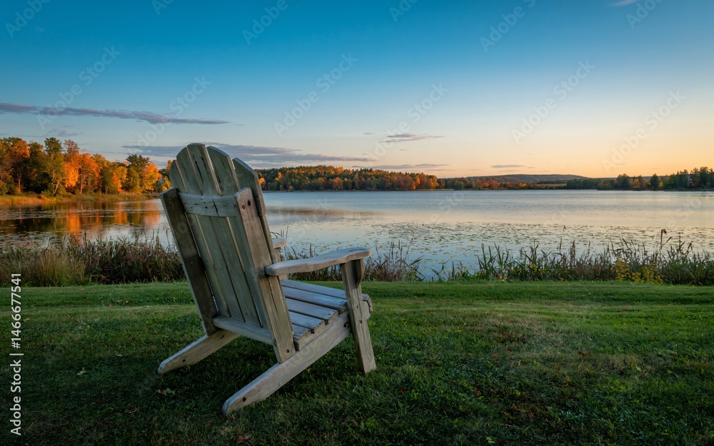 Fototapeta premium autumn Ontario, Canada, Empty Adirondack Chair Sunset Lakeside