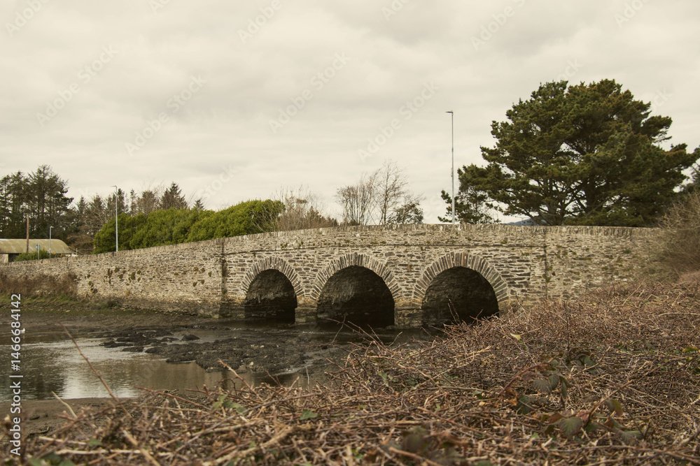 A bridge over a river without water at low tide in Ballydehob, West Cork, Ireland