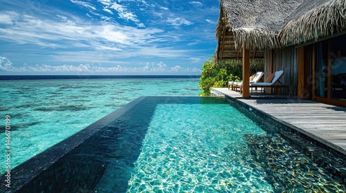 Tropical overwater infinity pool overlooking the ocean.