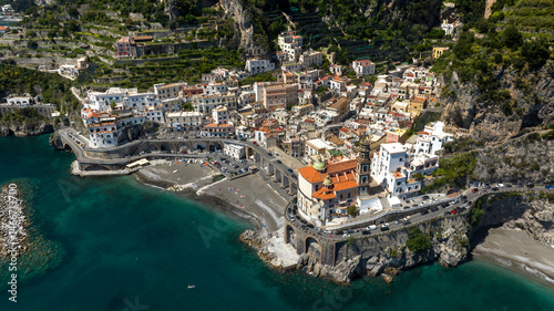 Aerial view of the town of Atrani, in the province of Salerno, in Campania, Italy. It is one of the most beautiful and touristic places on the Amalfi coast, overlooking the Mediterranean Sea.