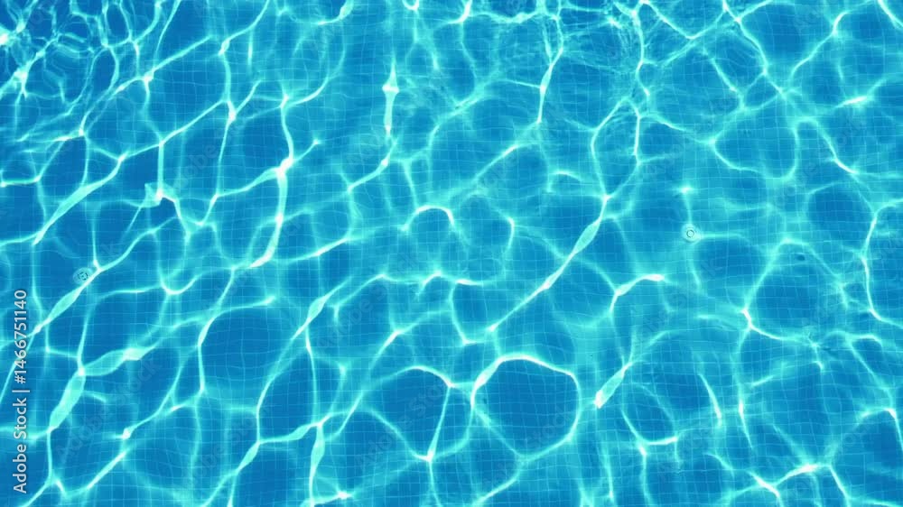 excitement on surface of blue water in swimming pool, top view, slow motion
