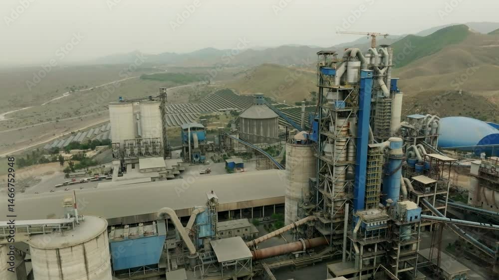 Aerial pan shot of a modernised cemet factory in Pakistan.