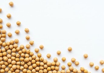 Scattered chickpeas on a white background creating a corner border with negative space for text or design