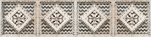 Old italian carved stone frame concept with geometric and foliage shape taken from the medieval frieze of the facade of italian church (Italy)