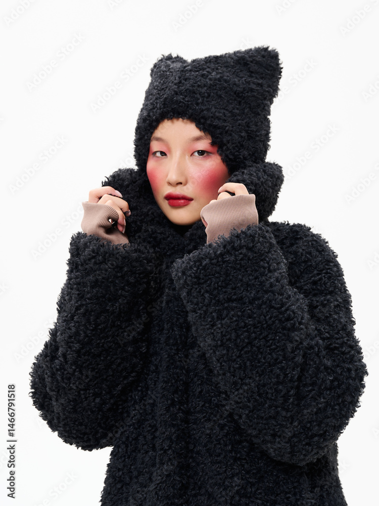 Street style fashion, Asian model in faux fur clothes on white studio background. Street style fashion, Asian model in faux fur clothes on white studio background.