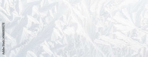 Abstract white ice texture with subtle frosty patterns and opacity variations, soft diffused lighting, slightly textured surface, creating a minimalist and ethereal panoramic background.

