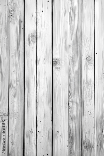 A close-up shot of a wooden wall with vertical planks, showcasing a light, weathered wood texture in black and white, evoking a rustic, minimalist vibe.