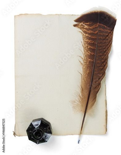 Quill pen with old manuscript and vintage glass inkwell isolated on a white background. Space for text