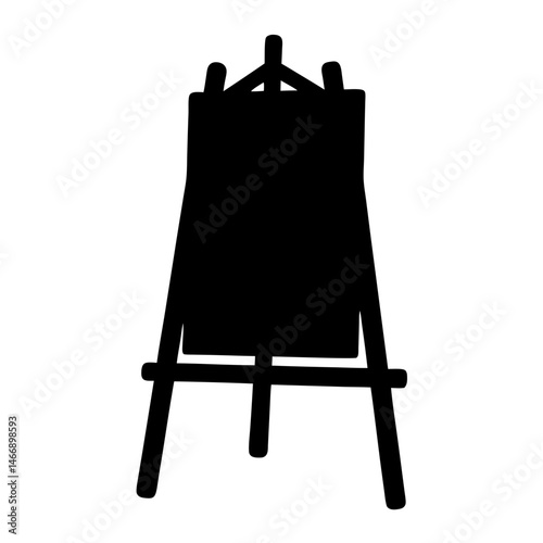 Black silhouette of an artist's easel ready for a blank canvas