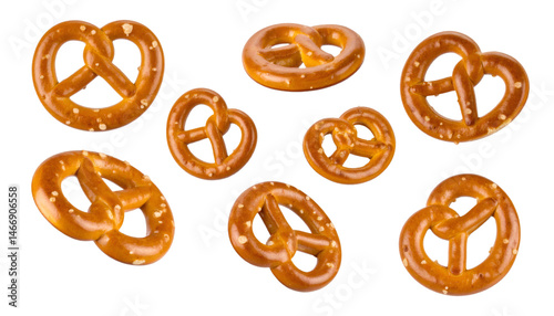 Multiple pretzel pieces levitating on transparent background