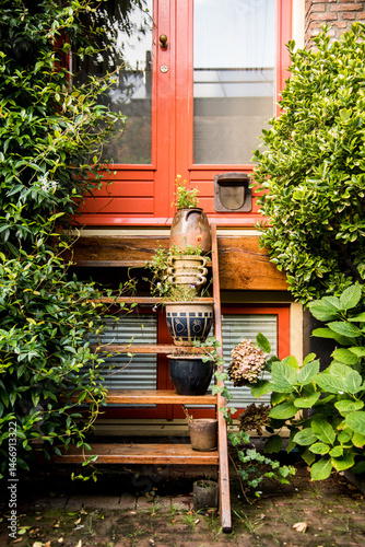 Cozy entrance with potted plants and garden stairs