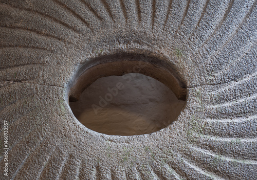 Detail of a millstone in a water wheel at Cotehele Cornwall