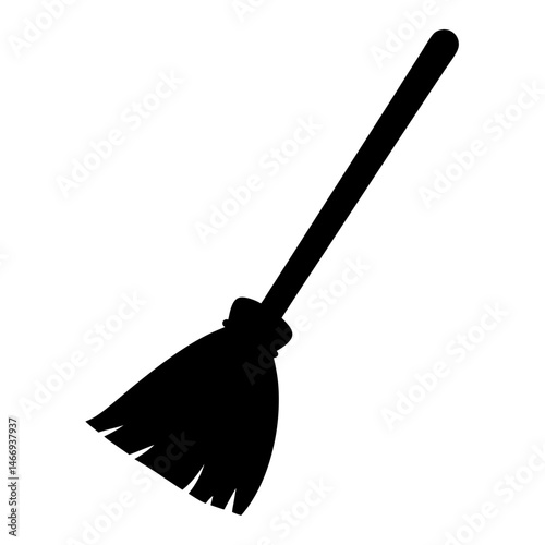 Black silhouette of a witch's broom, symbol of Halloween night