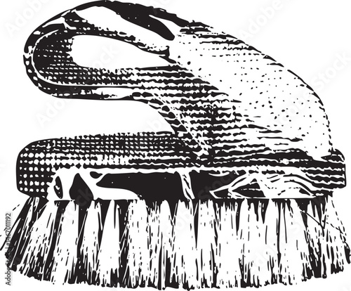 A pair of black scrubbing brushes rests on a white surface.