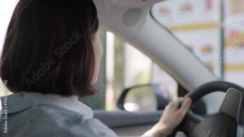 Woman Ordering Food from Car. Drive-Thru Scene