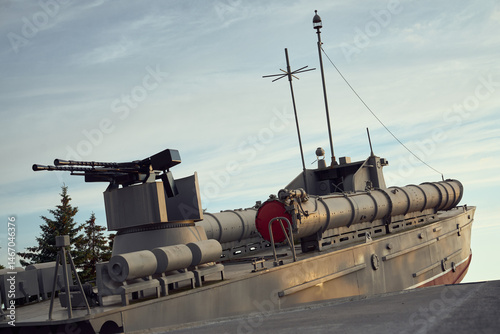 A torpedo boat sculpture with anti-aircraft guns and torpedo tubes. 