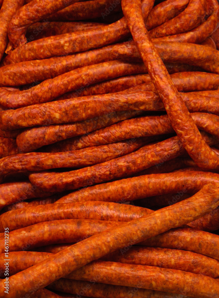 Close-up of many sausages at the market. Background with sausages