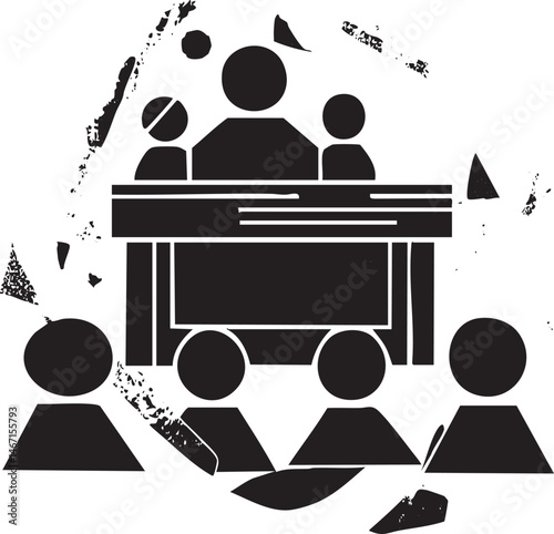 A group of people gather around a wooden table in a darkened room.