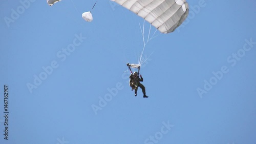Military paratrooper in the air, close-up