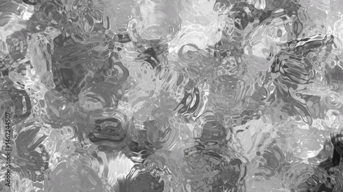 Abstract silver and black liquid texture background with glossy, metallic reflections. The design features smooth fluid waves and swirls, giving it a luxurious, futuristic