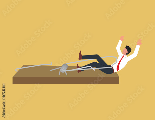 Young businessman catched in the mousetrap. Business trap and failure concept.