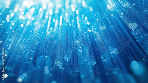 Abstract, vibrant blue light beams,  optical fibers,  illuminated,  modern design,  crystal clear,  water droplets,  reflective,  bokeh,  glowing