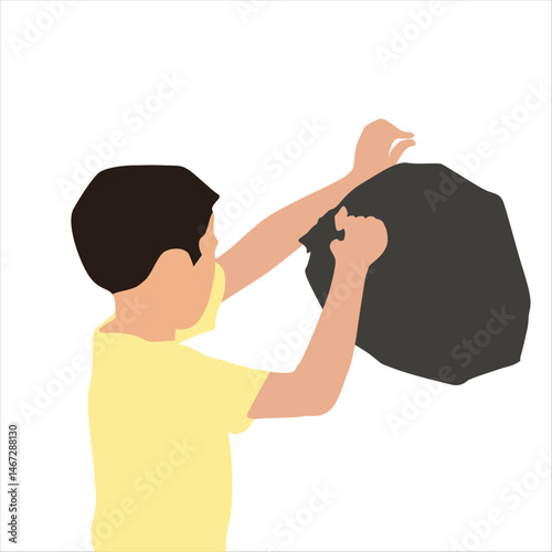 a boy disposes of a plastic bag of garbage