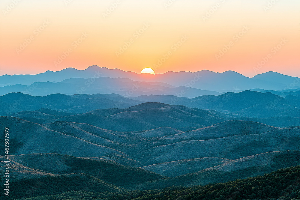 Obraz premium Sunset Over Blue and Orange Mountain Range