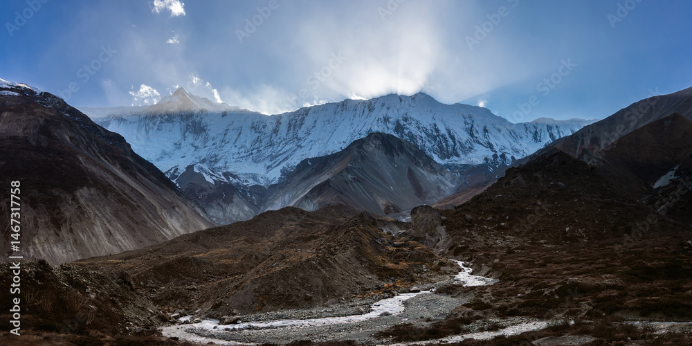 Fototapeta premium The sun is setting behind the Himalaya mountain. Mountain landscape near Tilicho base camp, Nepal.