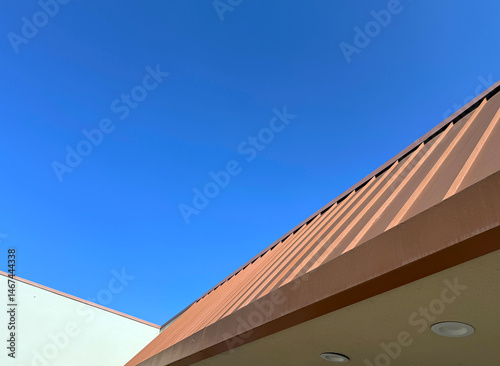 Commercial building roof and blue sky