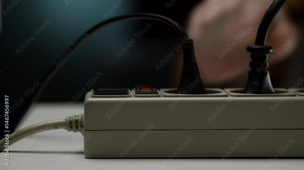 Close Up of Male Hand Turning Off Electrical Outlet Switch Close Up of Male Hand Turning Off Electrical Outlet Switch