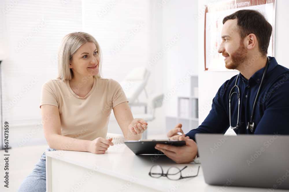 Woman having appointment with doctor in hospital Woman having appointment with doctor in hospital