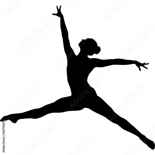 Silhouette of dancer in a dynamic pose performing dance fitness exercise in studio