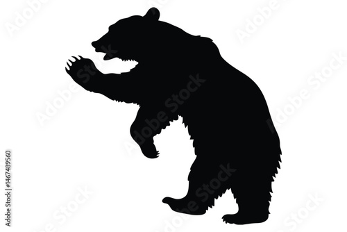 Bear Silhouette: A powerful black bear silhouette stands on its hind legs, a striking image of the wild's untamed spirit and raw strength. It's a versatile symbol for nature, conservation.