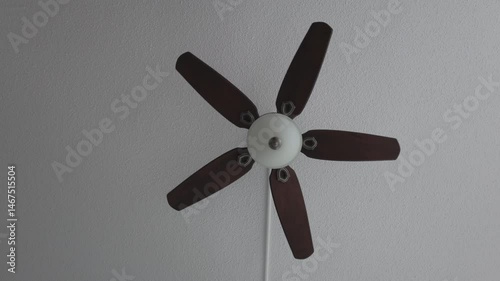 Celling fan slow spining heavy wooden fins front look