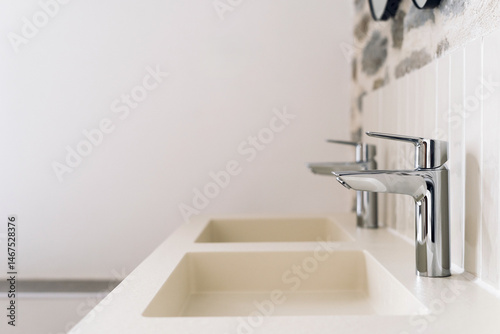 Stylish bathroom interior with modern faucets and minimalist design elements