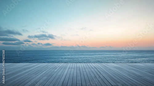 Fototapeta Naklejka Na Ścianę i Meble -  A calm ocean at dusk with wooden deck in foreground, showcasing a beautiful sunset view.