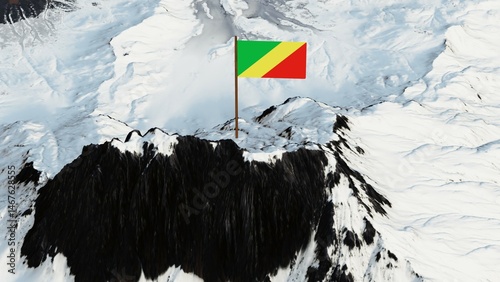 3D rendering of the Republic of the Congo's national flag, featuring a yellow diagonal band dividing a green upper triangle and a red lower triangle, gracefully waving atop a snow-covered mountain pea