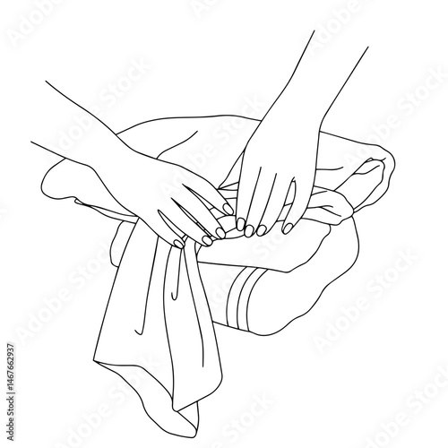 Hands folding clothes in a minimalist style  