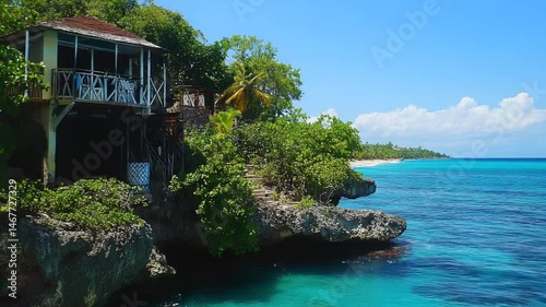Secluded Tropical House on a Cliffside Overlooking Turquoise Ocean