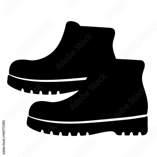 Black work boots stacked together, ready for outdoor labor and adventure