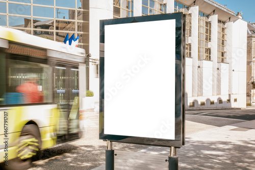 Blank billboard in front of modern glass building - mockup