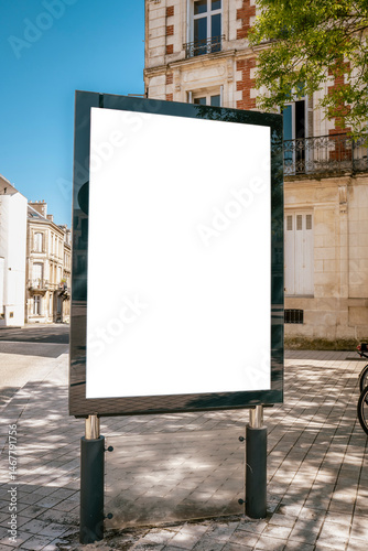 Blank billboard on tiled sidewalk near historic corner - mockup